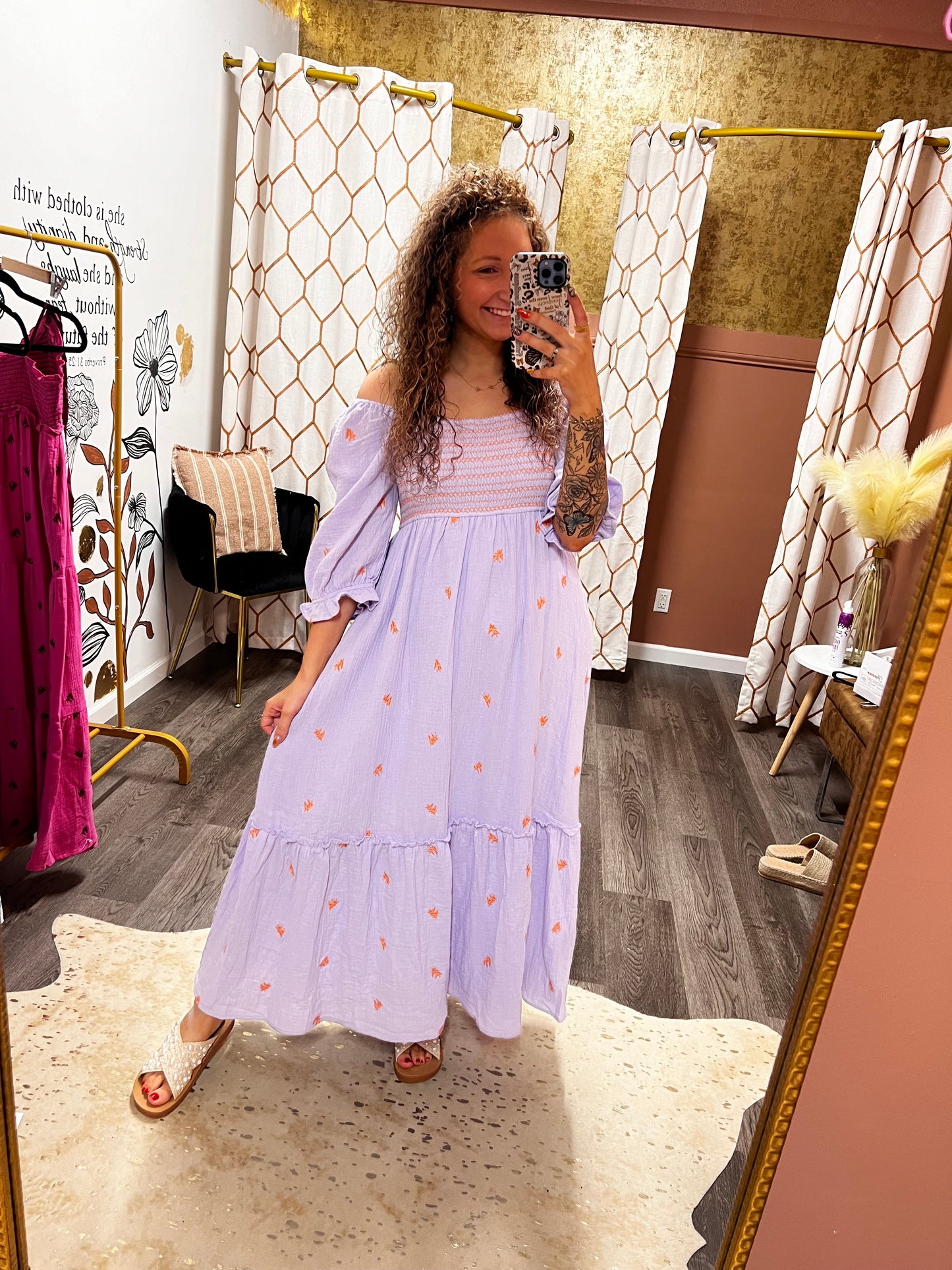 people and orange embroidered dress
