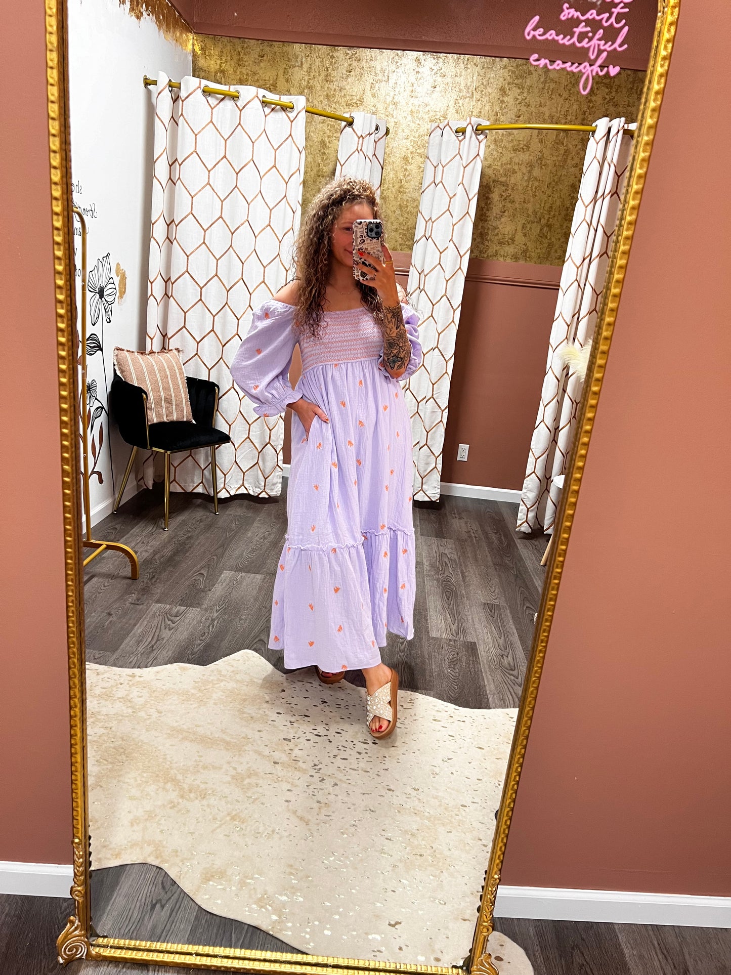 people and orange embroidered dress