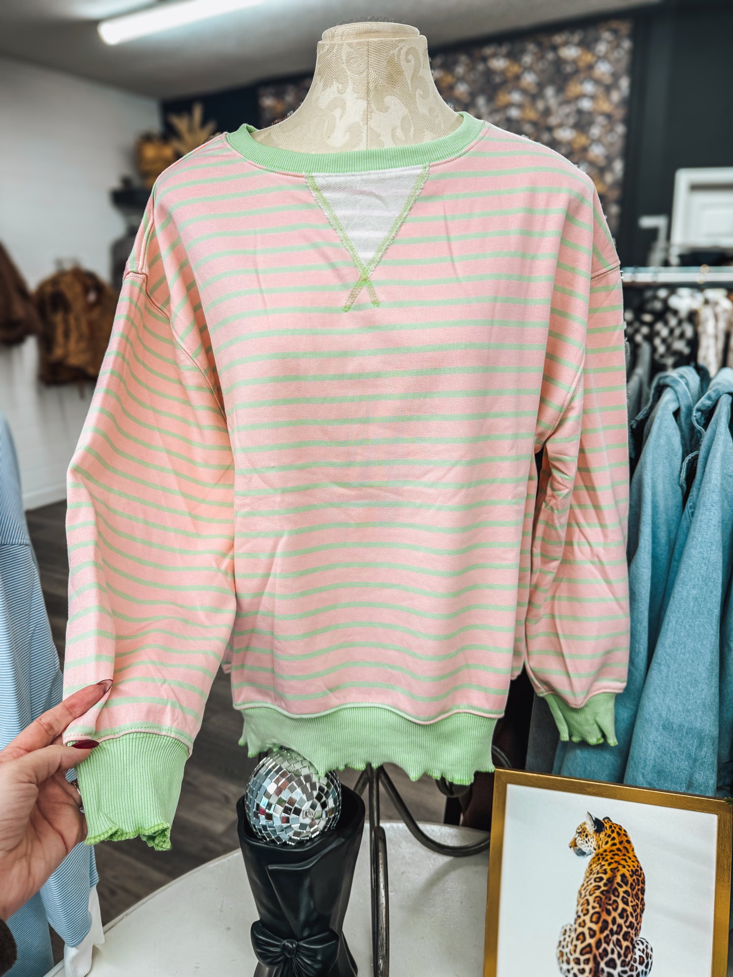 pink and green striped top with lettuce hem