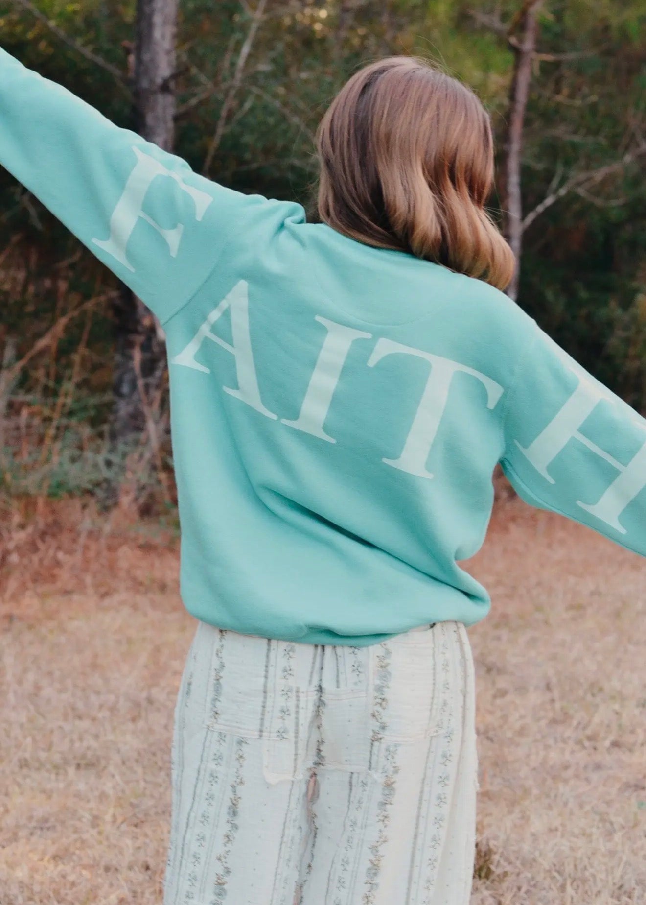 believer-faith teal pullover