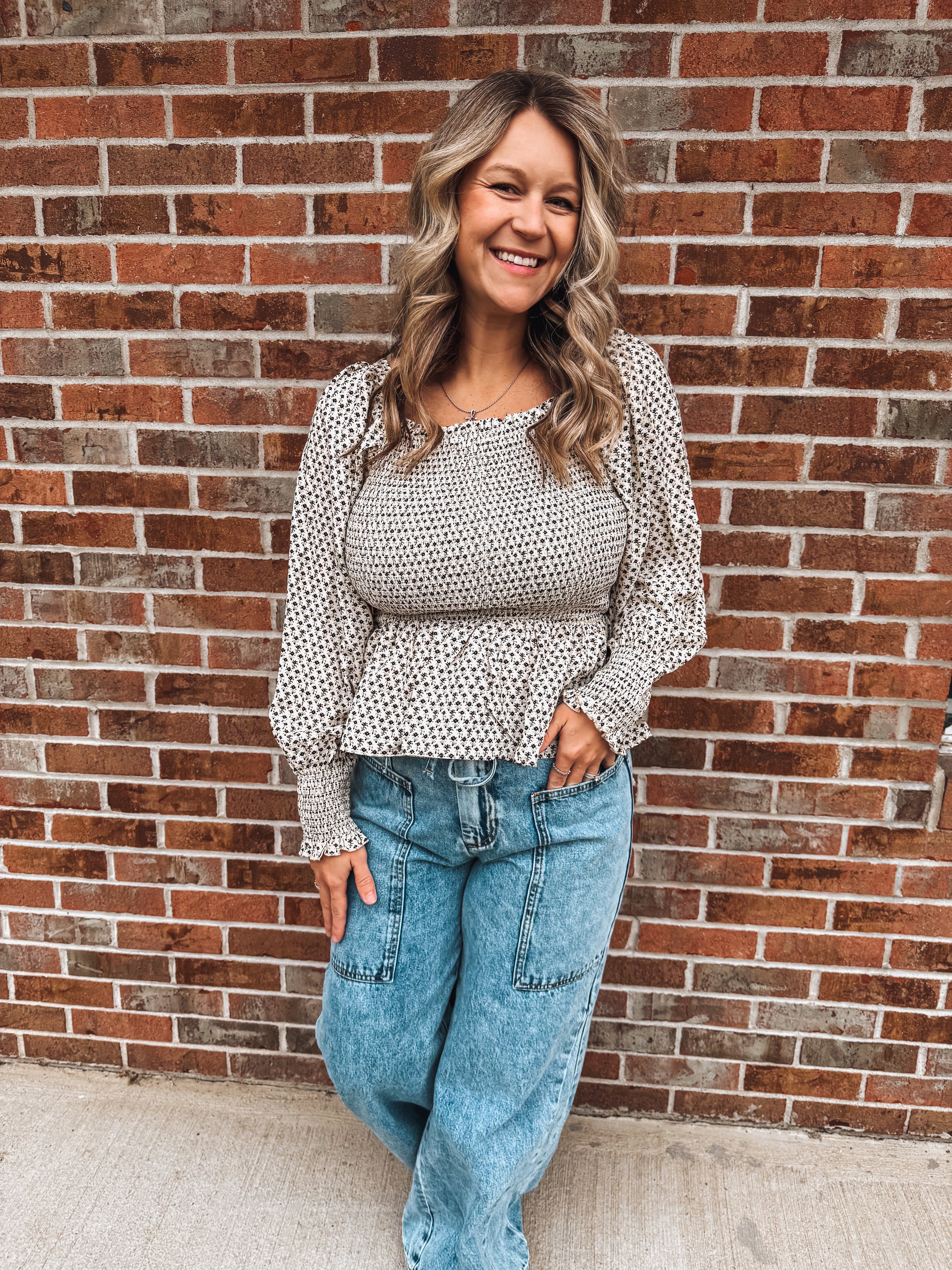 black and ivory floral smocked top