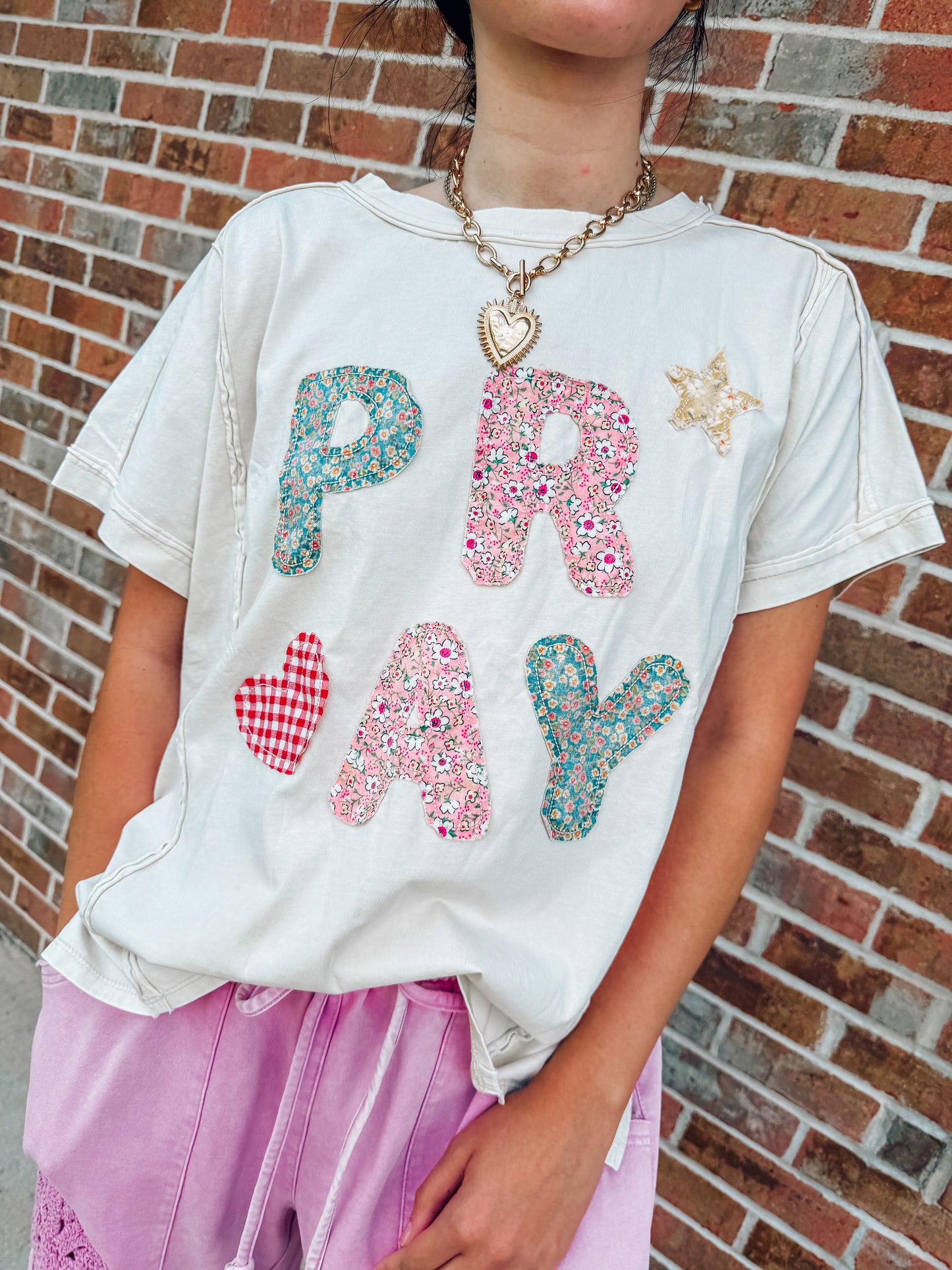 Pray appliqué floral top
