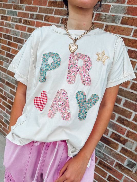 Pray appliqué floral top