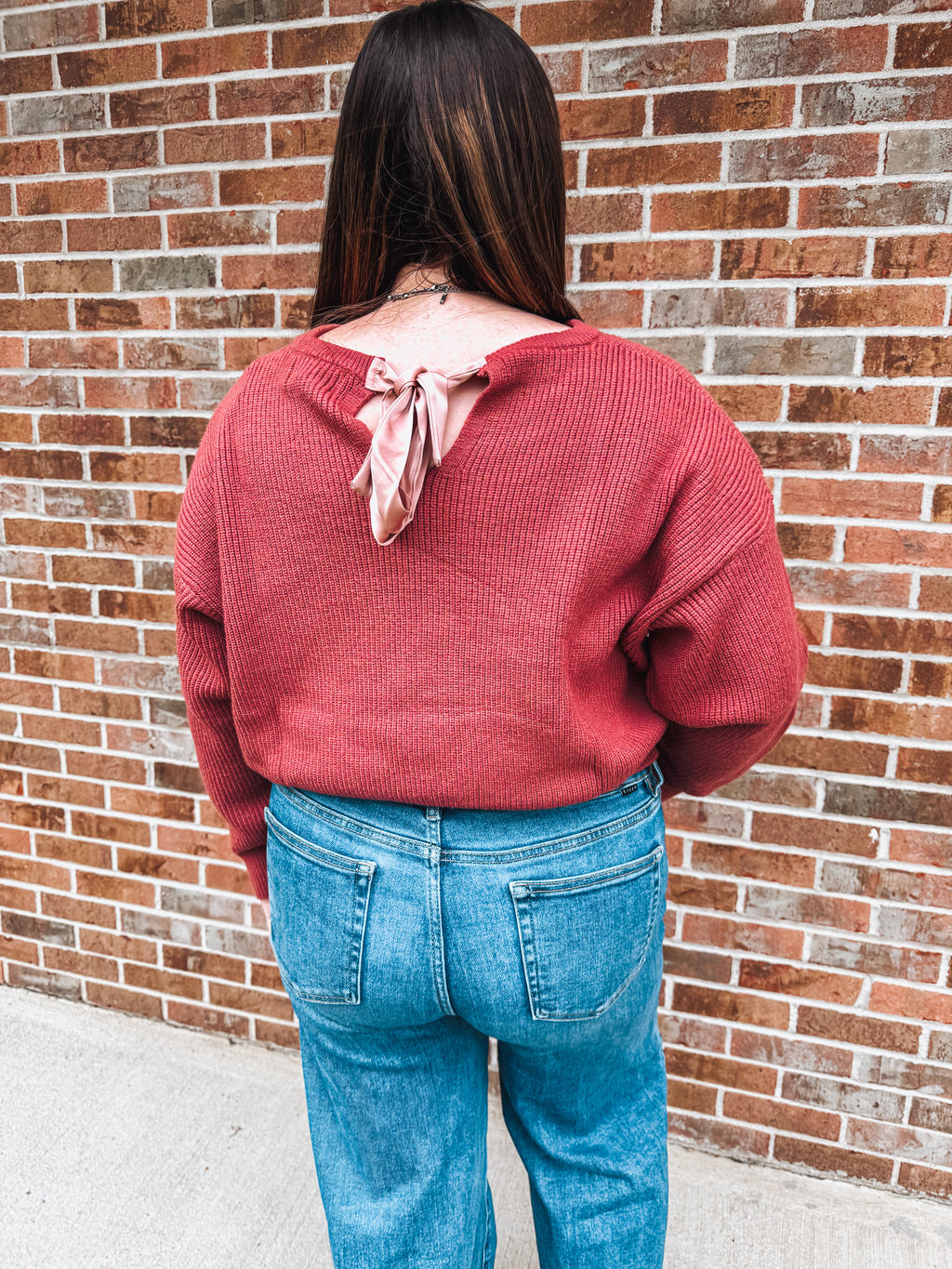 rose fall sweater with bow tie detail in the back