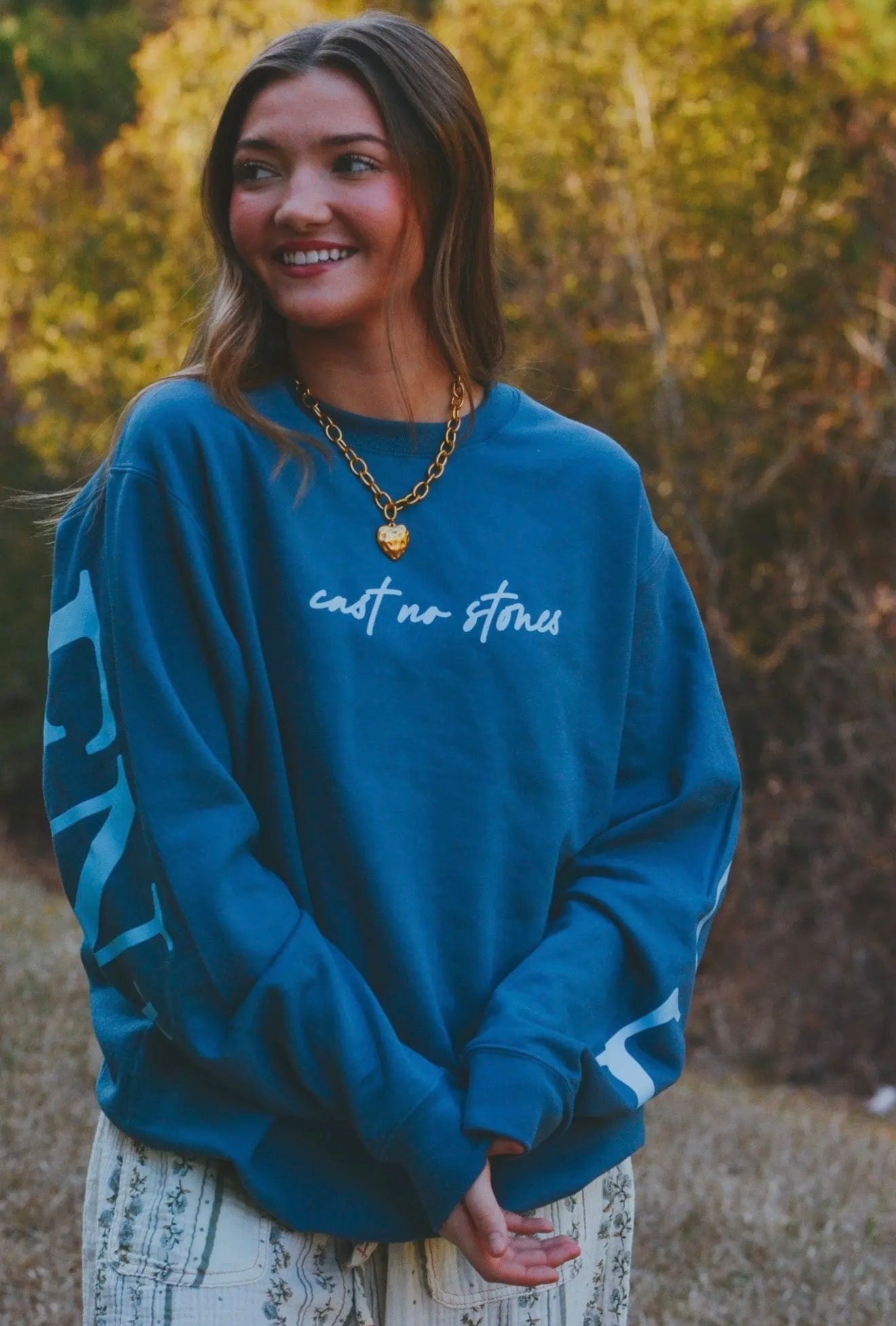 cast no stones-forgiven blue pullover