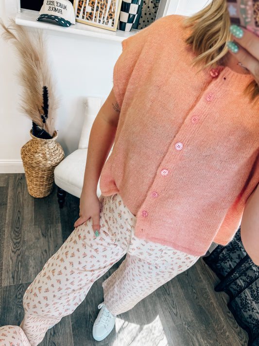 light pink sleeveless button down sweater