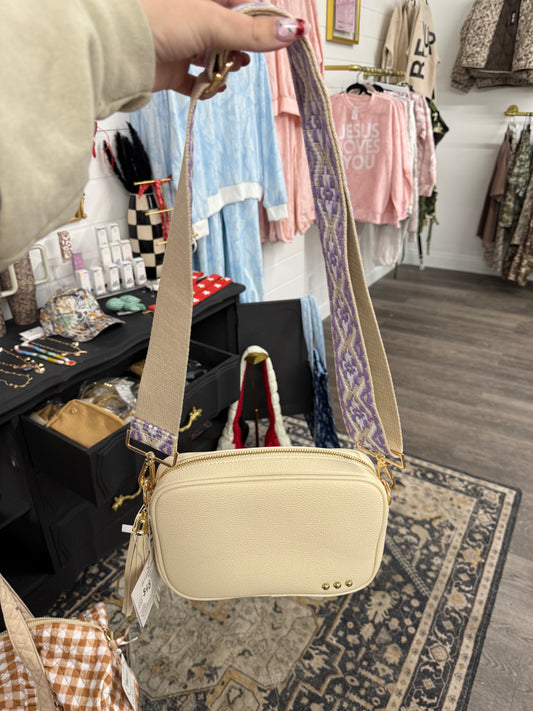 cream with purple strap crossbody bag